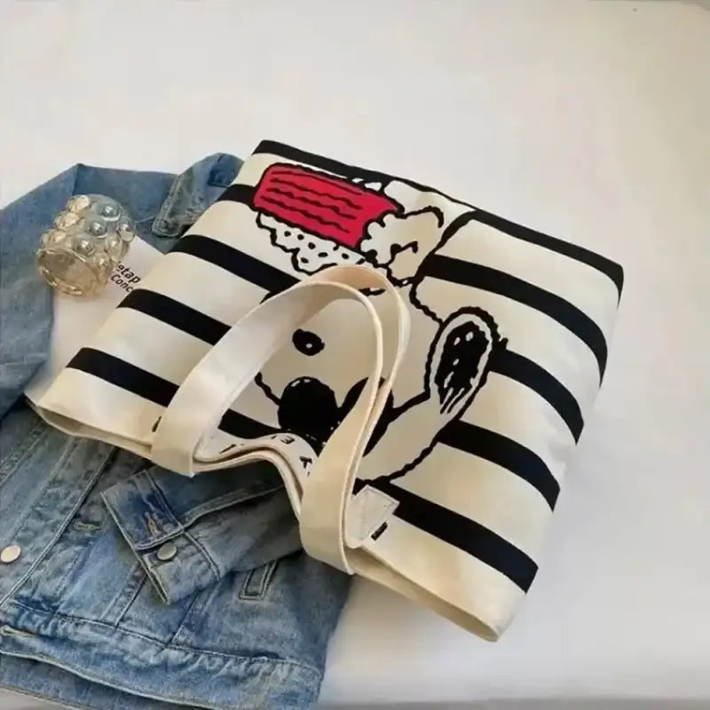 Striped tote bag with cartoon character.