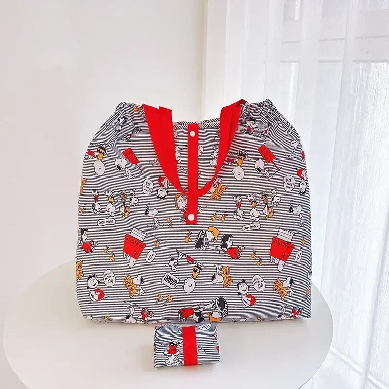 Striped Snoopy-themed tote bag.