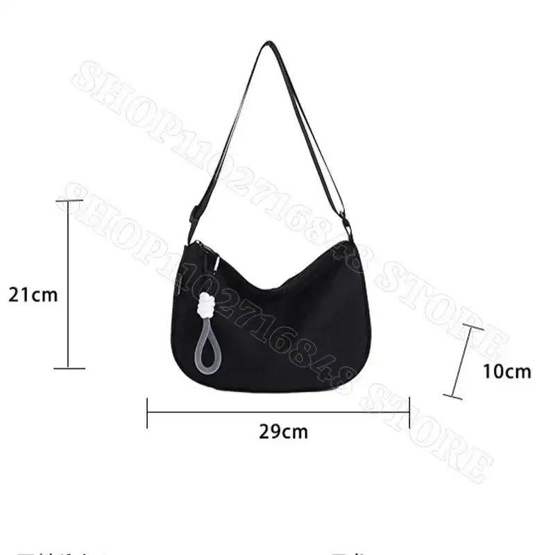 Black shoulder bag with dimensions.