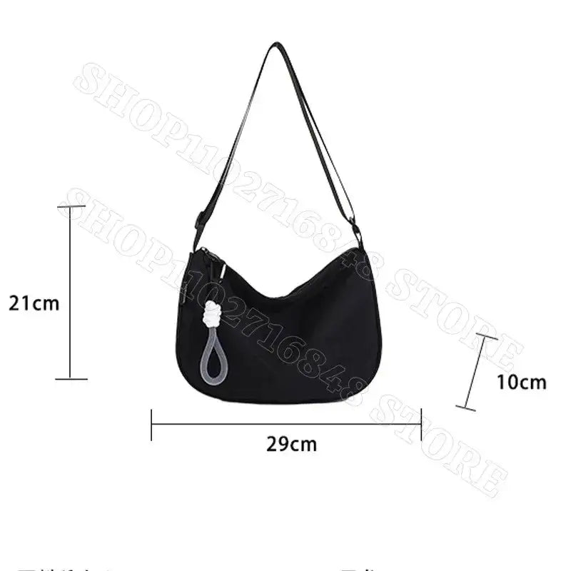Black shoulder bag with dimensions.