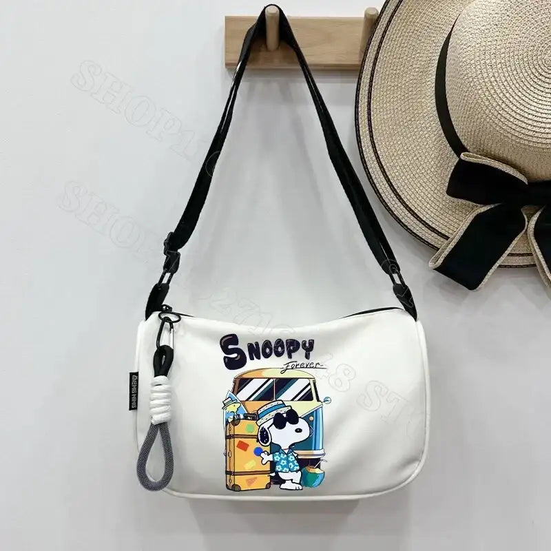 Snoopy-themed white shoulder bag.