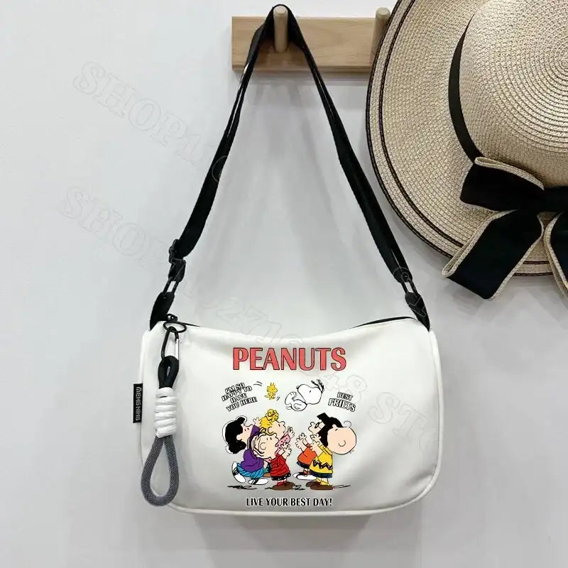 White Peanuts cartoon shoulder bag.