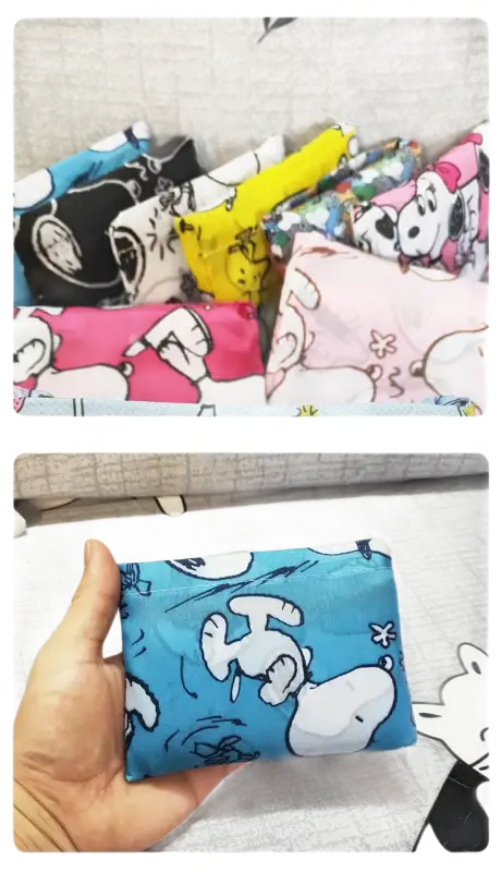 Colorful Snoopy-themed reusable shopping bags.