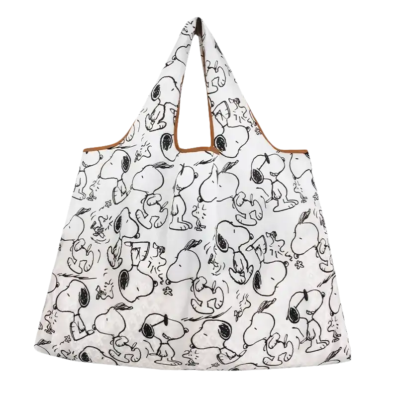 White tote bag with Snoopy pattern.