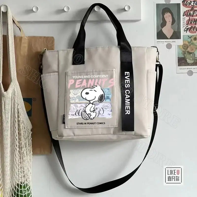 Beige tote bag with Snoopy design.