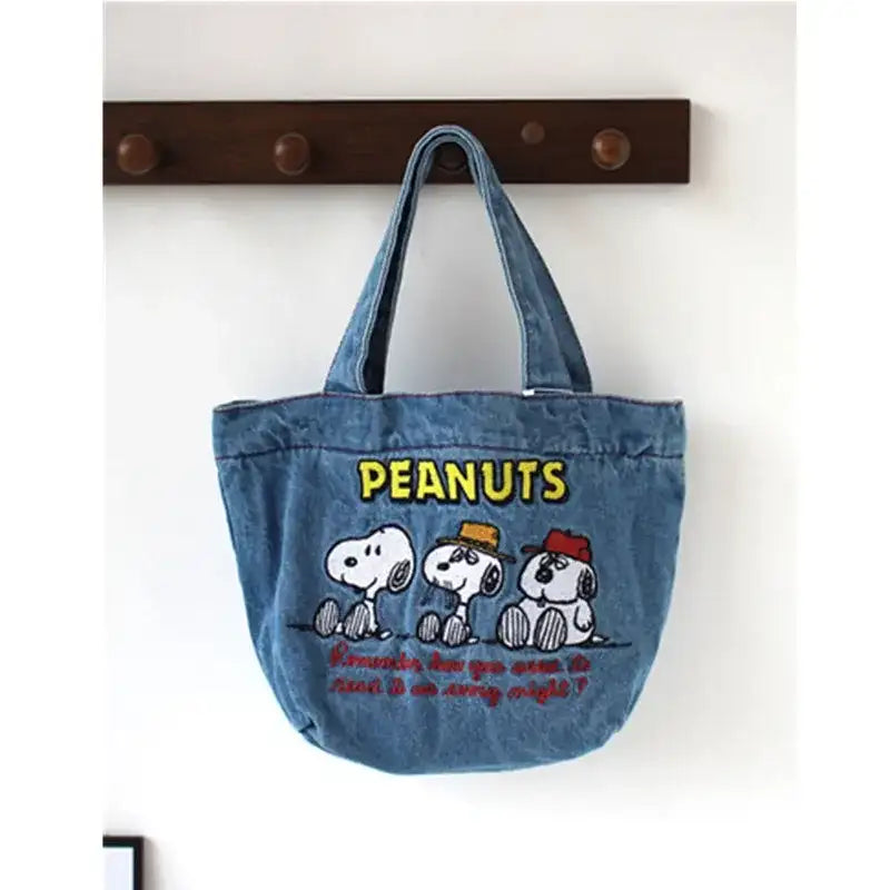 Denim tote bag with Peanuts characters.