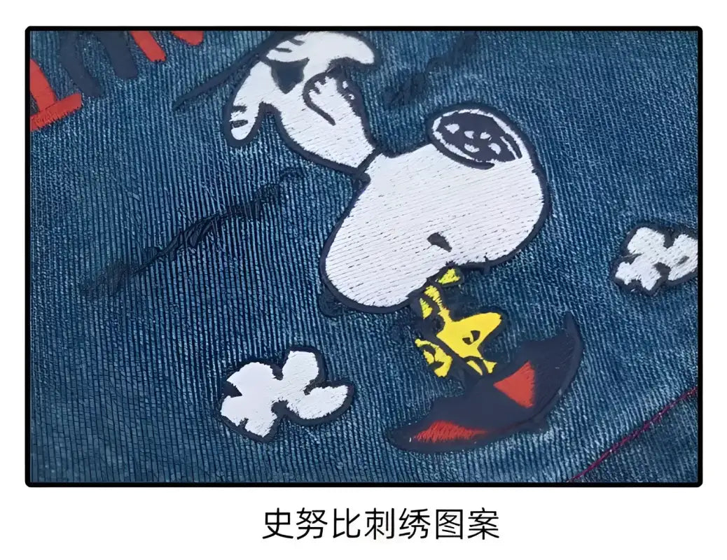 Snoopy embroidery on denim.