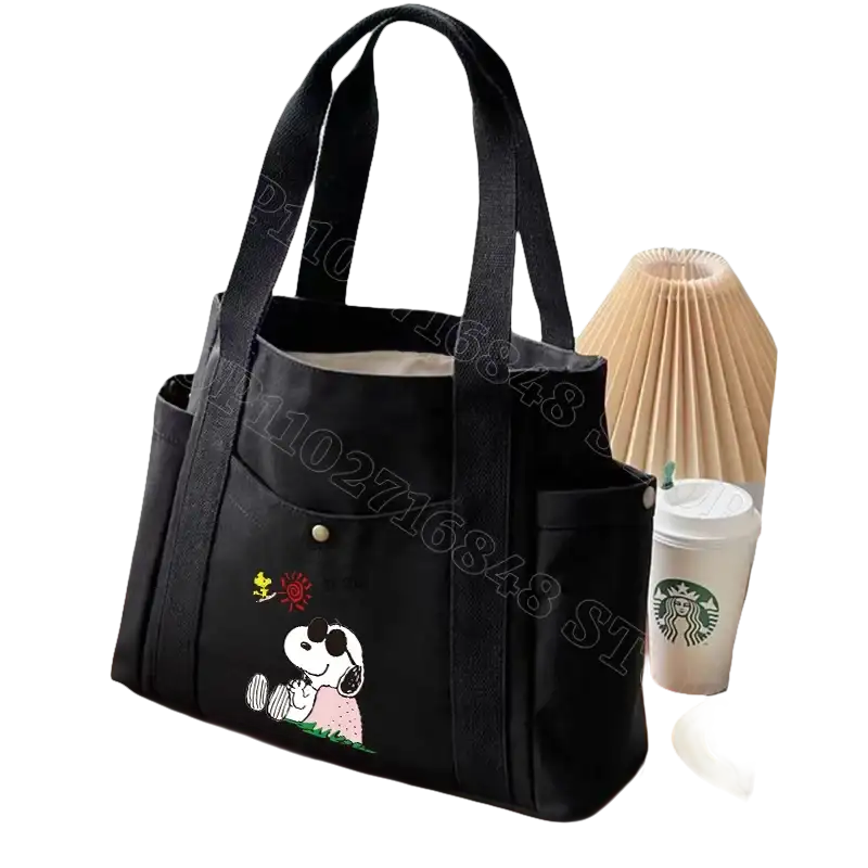 Black canvas tote bag with Snoopy design.
