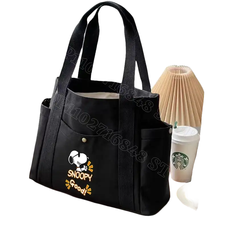 Black canvas tote bag with Snoopy design.