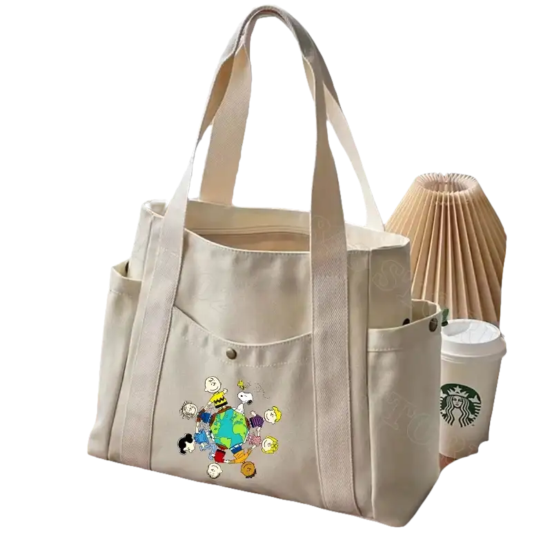 Beige canvas tote bag with cartoon characters.