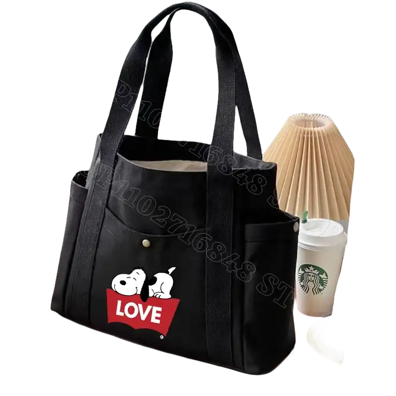 Black canvas tote bag with Snoopy design.