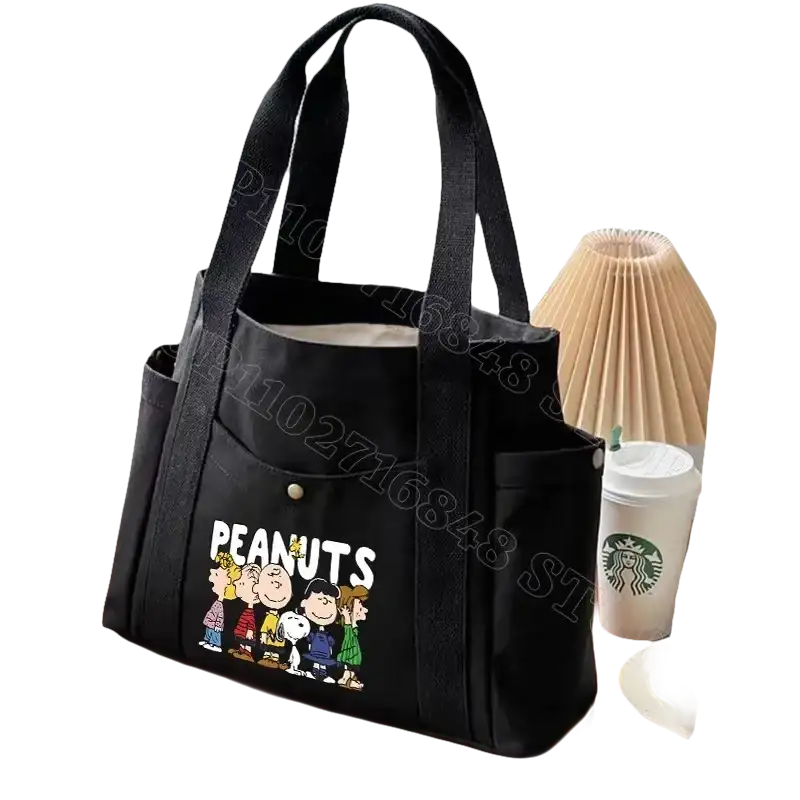 Black canvas tote bag with Peanuts characters.