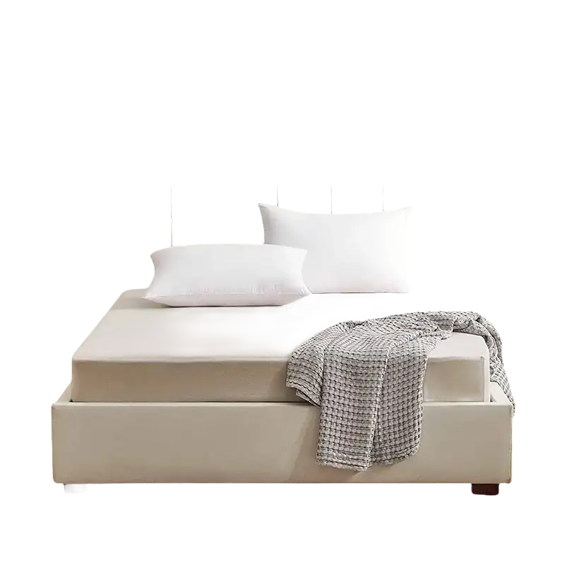 Beige upholstered bed with white pillows.