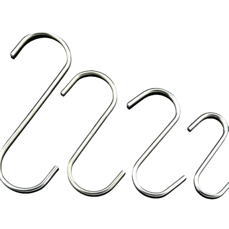 Four shiny metal S-hooks.