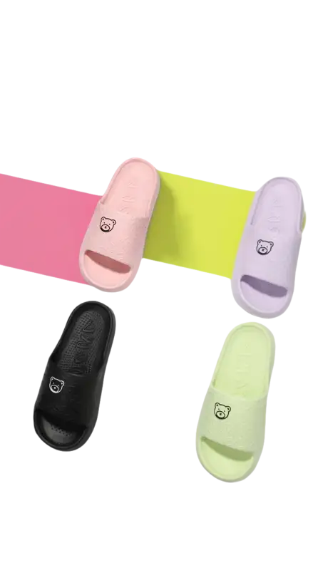 Colorful cartoon-themed slide sandals.