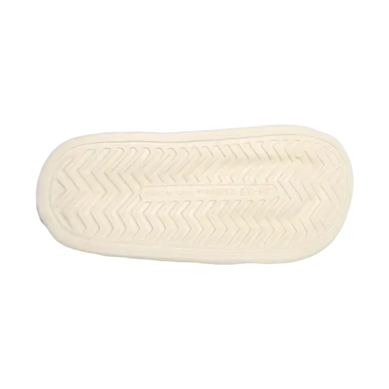 Cream-colored shoe sole with zigzag pattern.
