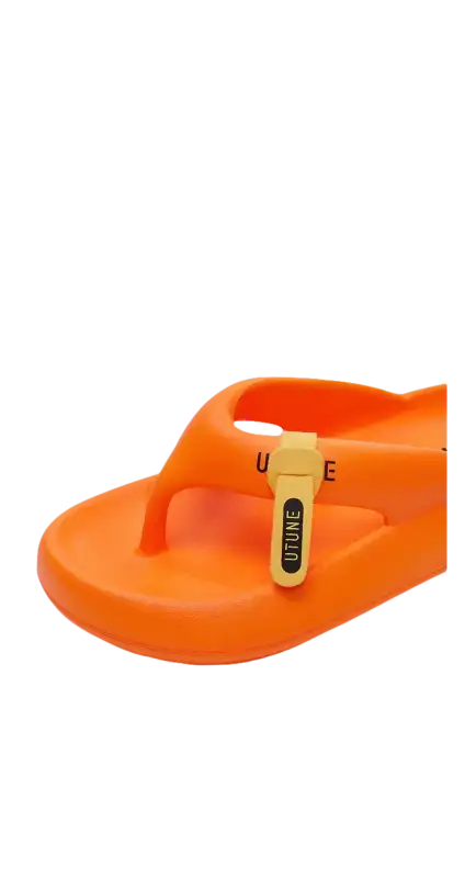 Orange flip-flop with a yellow charm.
