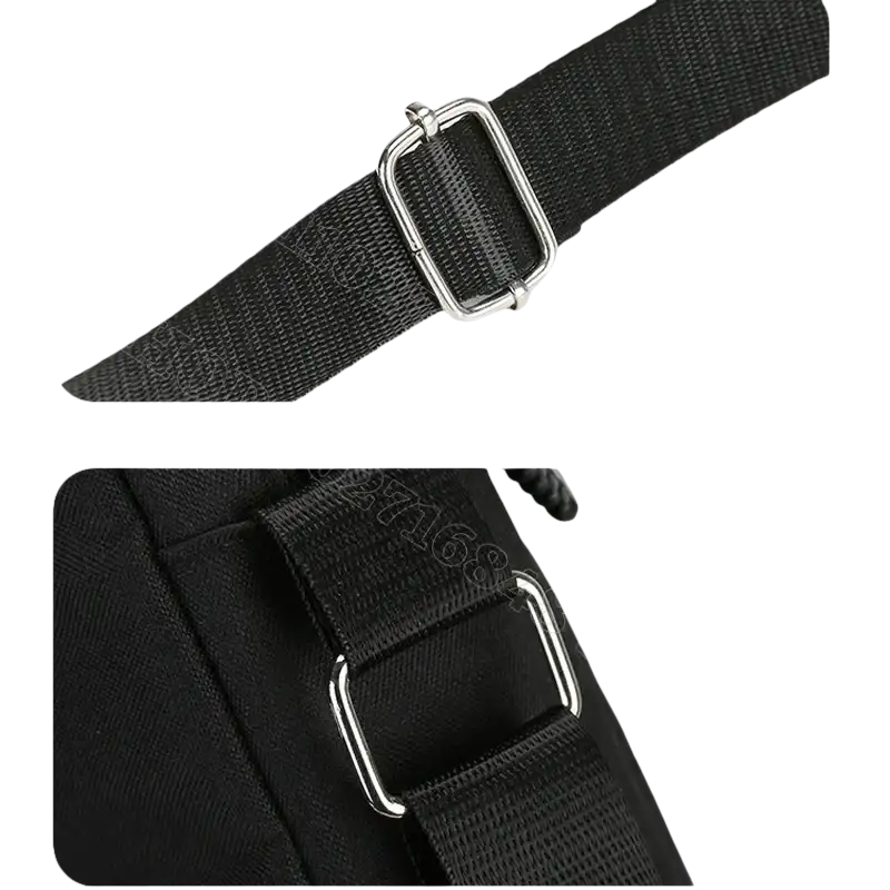 Black bag strap with metal hardware.