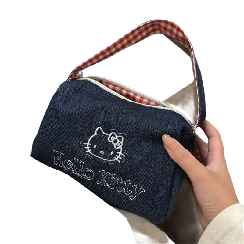Denim Hello Kitty handbag with gingham handle.