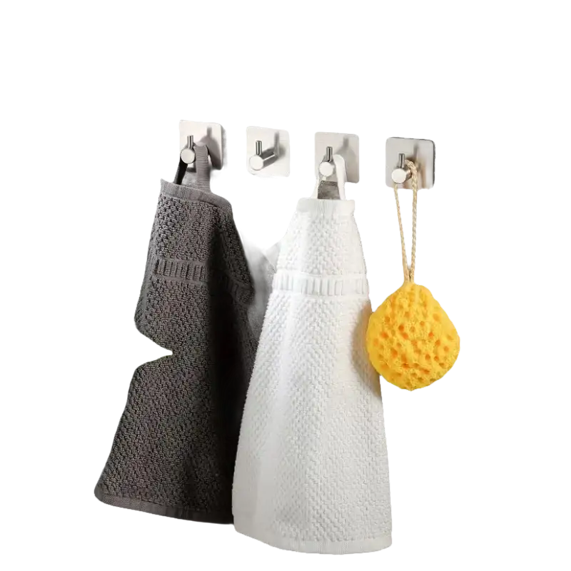 Bathroom towels and sponge on hooks.