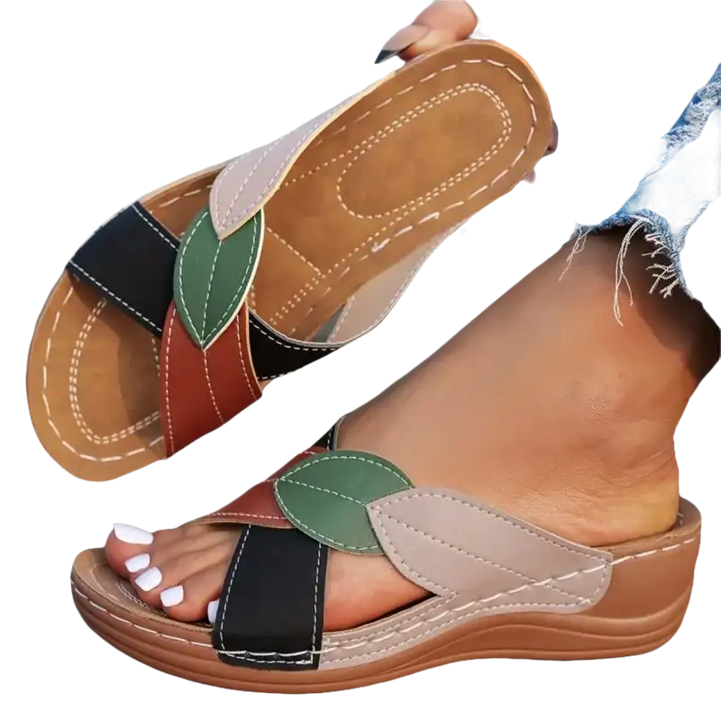 Women’s leaf-accented slide sandals.