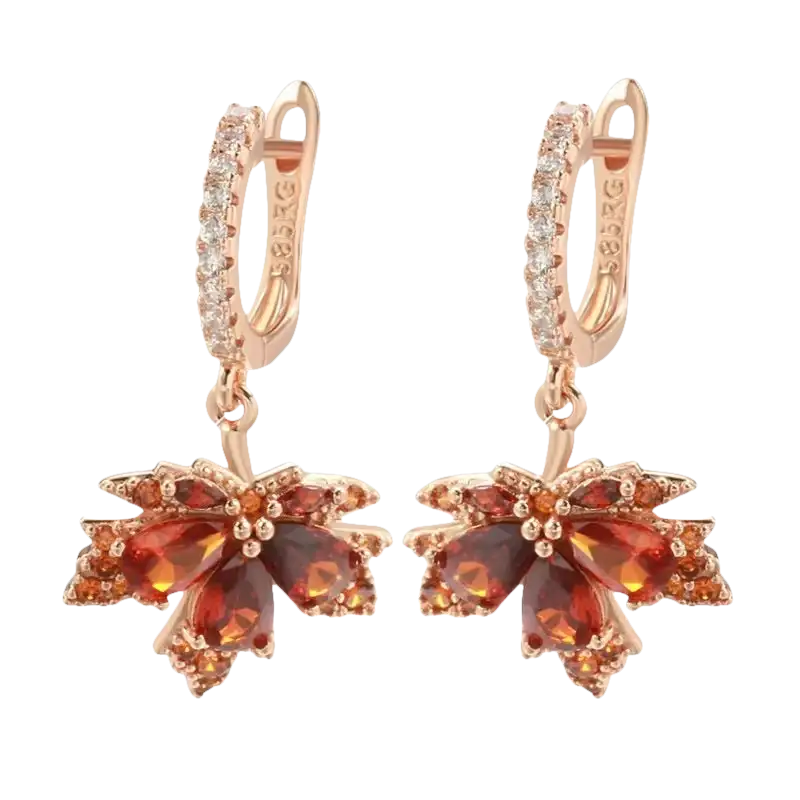 Pair of rose gold maple leaf earrings.