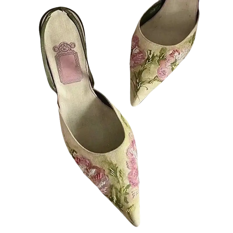 Floral embroidered pointed-toe heels.