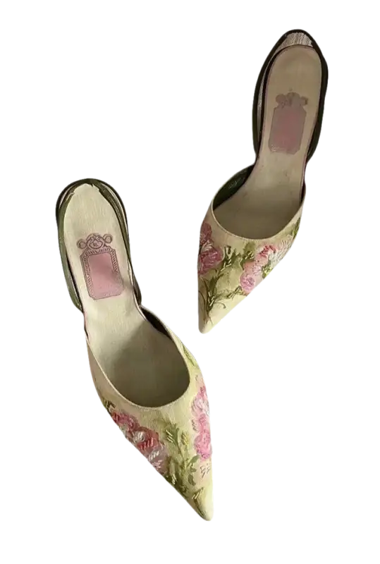 Floral embroidered slingback heels.