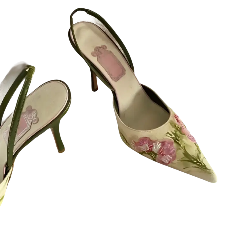 Floral embroidered slingback heels.