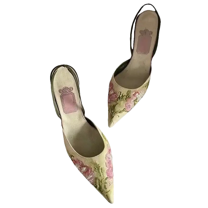 Floral embroidered slingback heels.