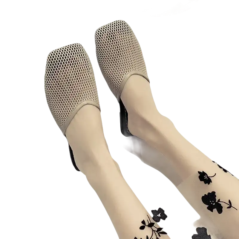 Beige mesh mules with floral stockings.