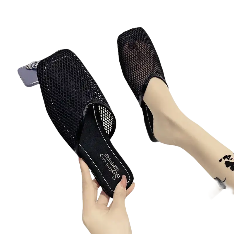 Black mesh slip-on shoes.