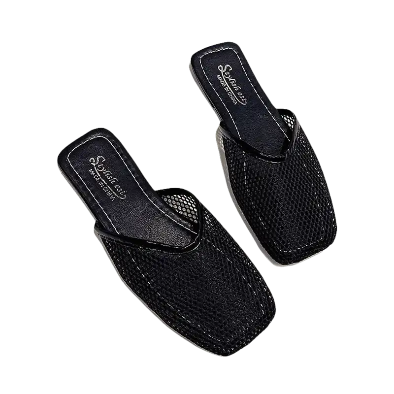 Pair of black mesh slip-on sandals.