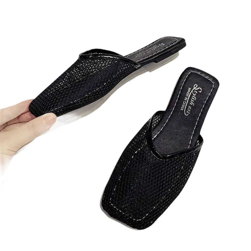 Pair of black woven mules.
