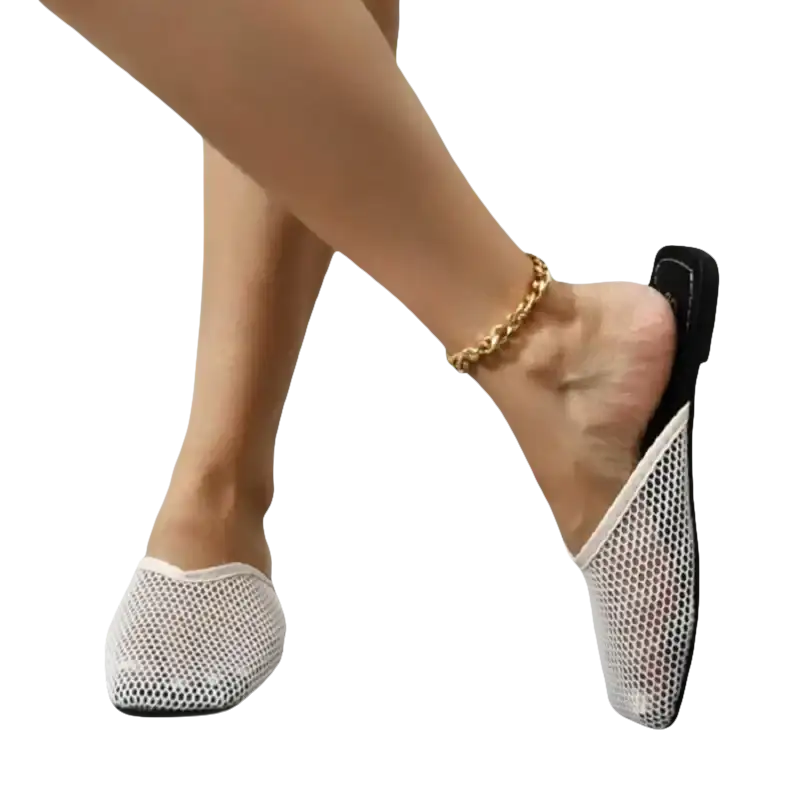White mesh mule shoes.
