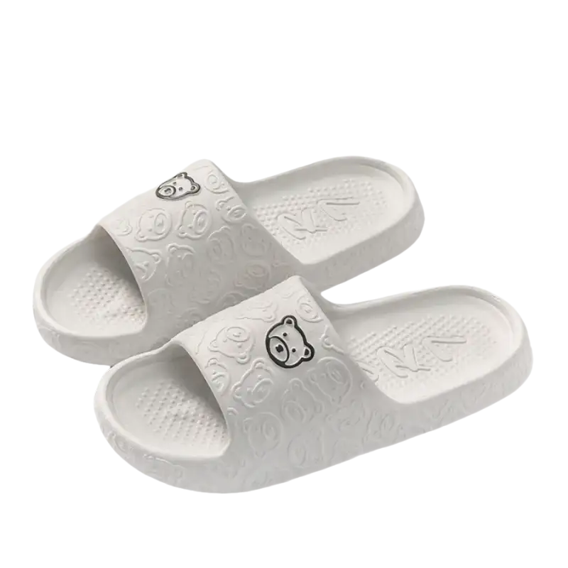 White bear-themed slide sandals.