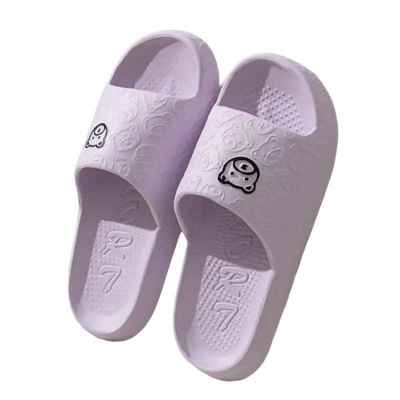 Pair of lavender cartoon-decorated slide sandals.