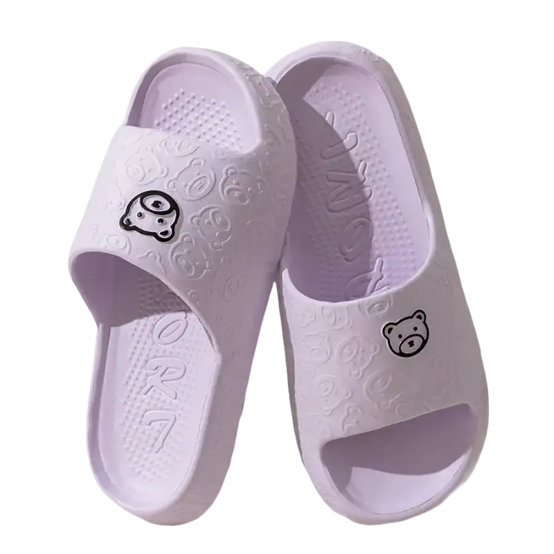 Pair of lavender cartoon-themed slide sandals.