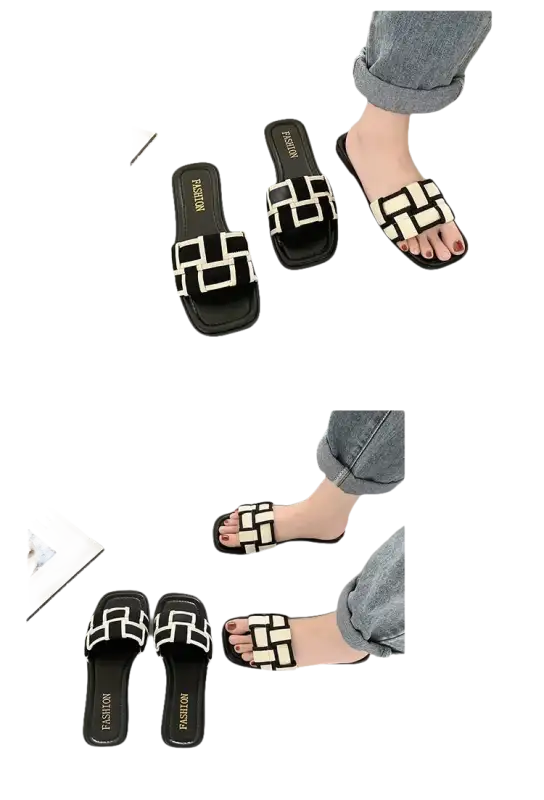 Black and white patterned slide sandals.