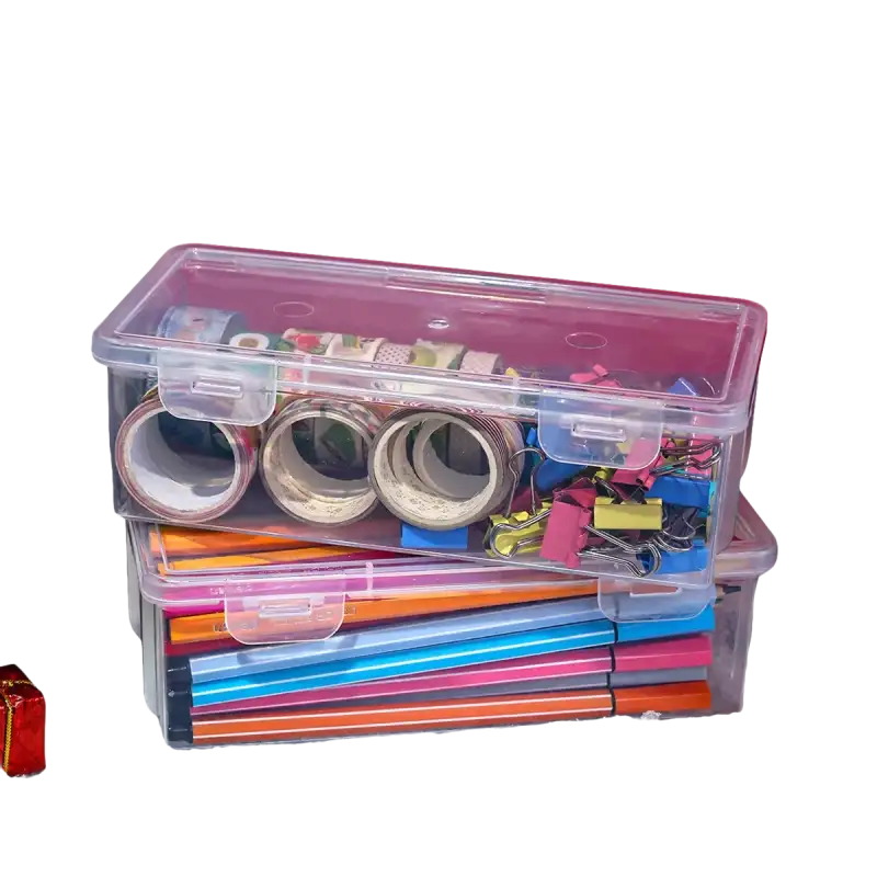 Two clear Transplo Boxes for pasta and pen organizing in a transparent plastic desktop
