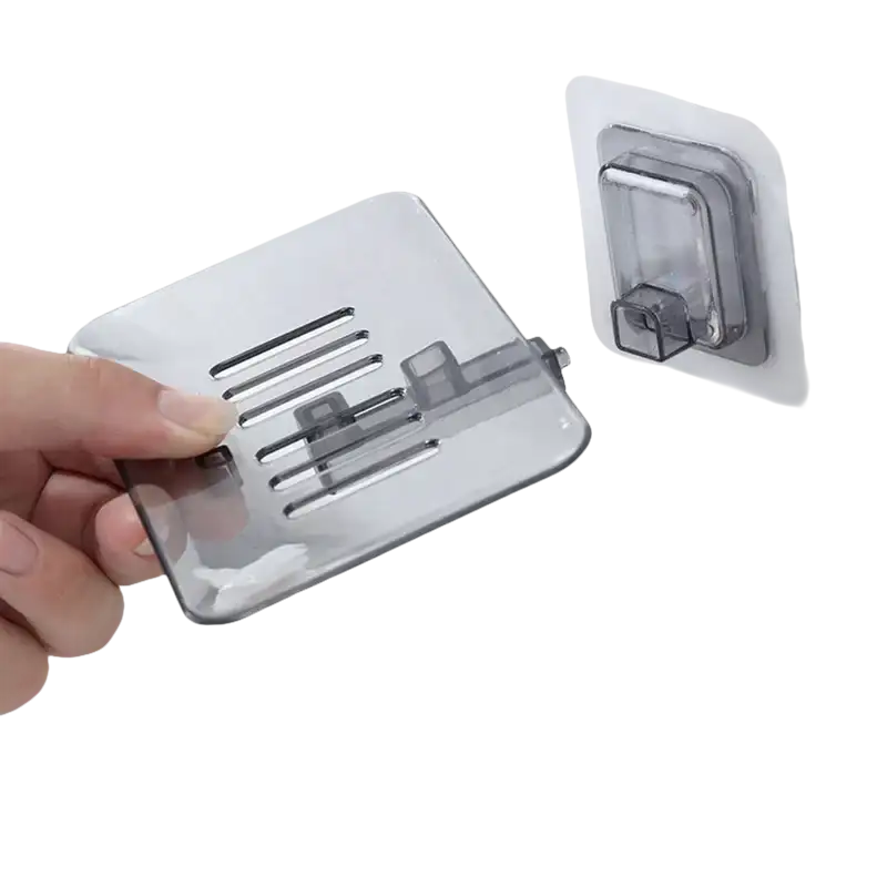 Gray plastic drain soap holder with adhesive mount for trendy bathroom storage