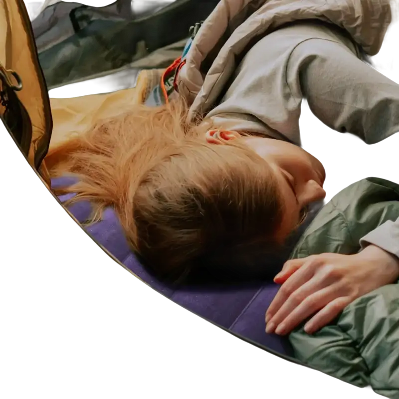 Sleeping woman in tent with campcomfort inflatable neck pillow for outdoor camping adventure