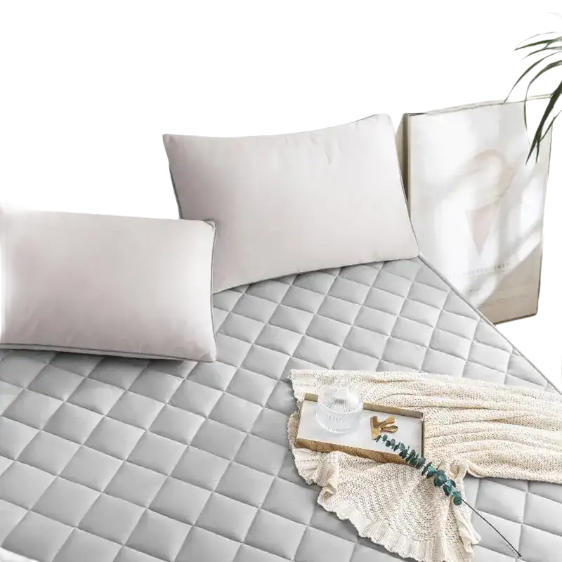 Quilted gray mattress pad.
