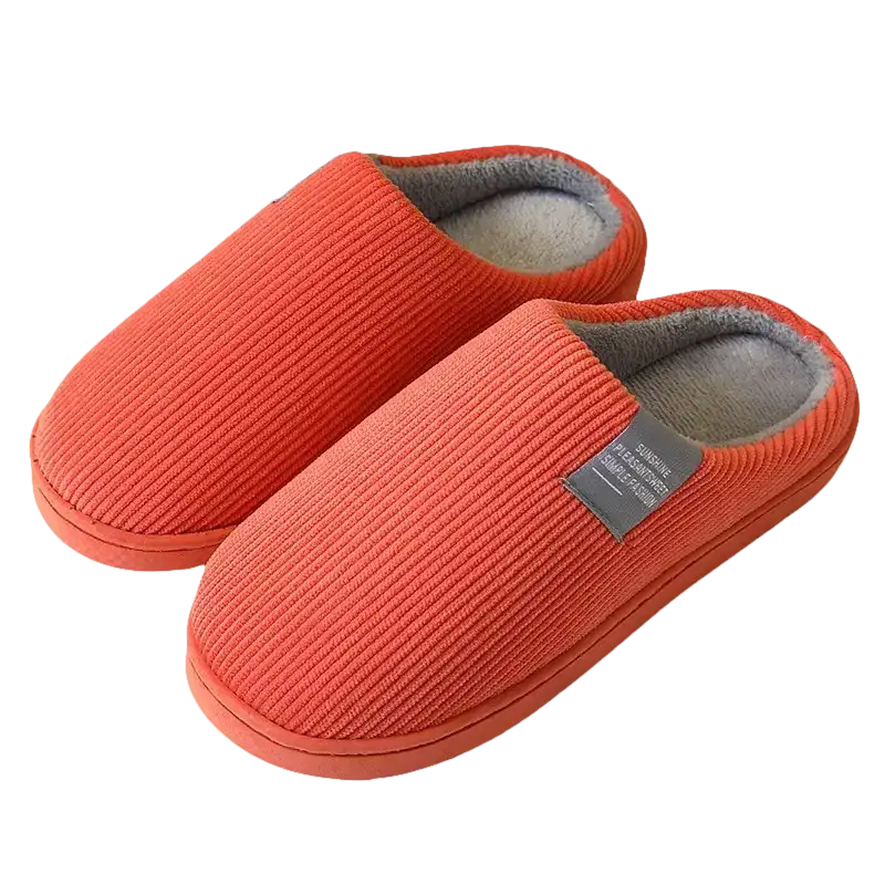 Pair of orange corduroy slippers.