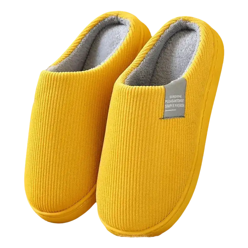 Yellow corduroy slippers with gray lining.