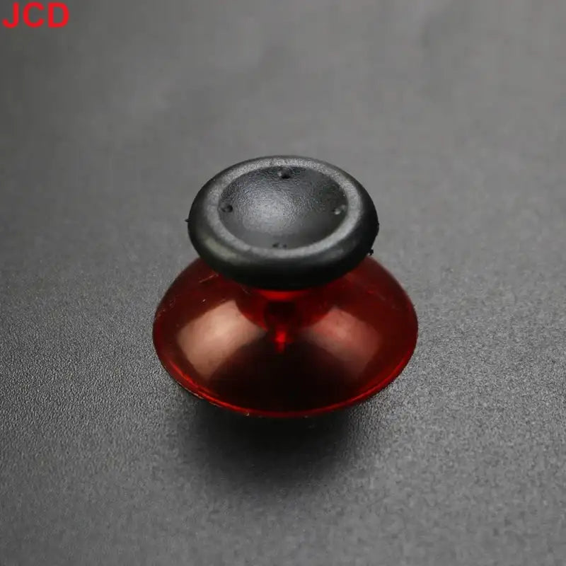 Red and black joystick.