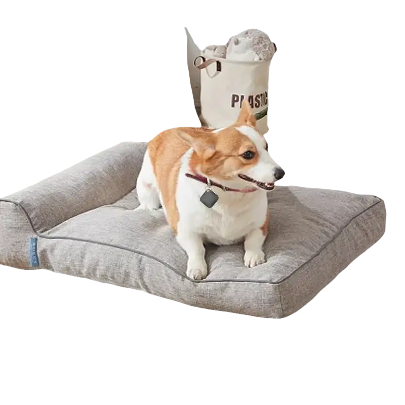 Gray pet bed with a bolster.