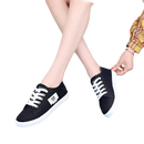 Black canvas sneakers.