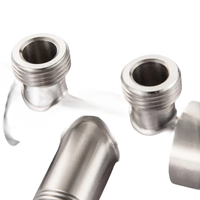 Metal pipe fitting with threaded ends.