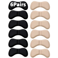 Six pairs of black and beige heel cushion inserts.